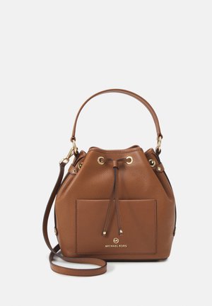 Brown leather bucket bag with drawstring closure, top handle, front pocket, and detachable long strap.