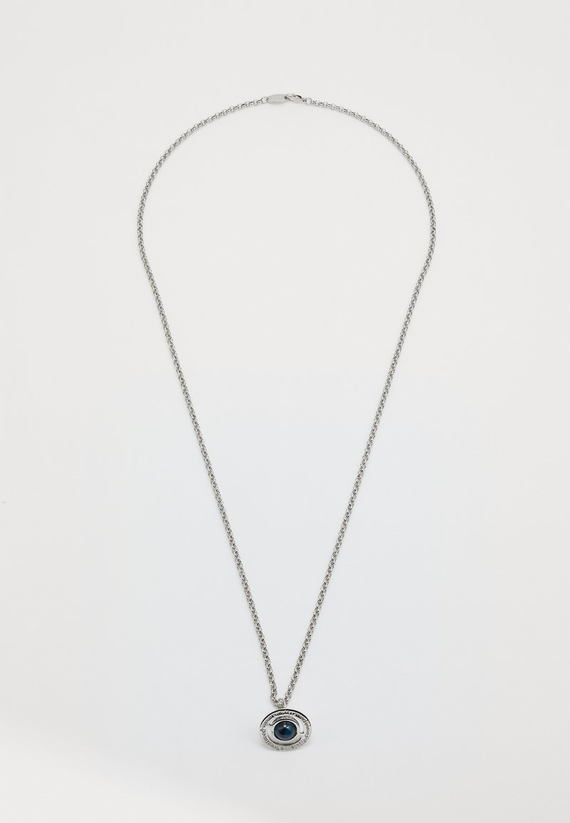 Silver chain necklace featuring a circular pendant with a central blue gemstone, surrounded by a textured silver border.