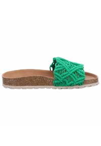 Sandalia de slid verde tejida con suela de corcho, que presenta un diseño de tira texturizada y una plantilla de color marrón claro. La altura del tacón es mínima.