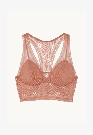 Bralette en dentelle de couleur pêche douce avec des motifs géométriques, des bonnets triangulaires et de larges bretellesintriquées pour le soutien. Tissu texturé.