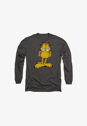 Langärmliges, dunkelgraues Hemd mit einer erschlafften gelben Cartoon-Katze, die einen schelmischen Ausdruck hat, die Arme verschränkt und große Pfoten.