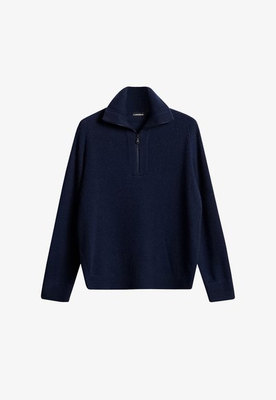 Maglione pullover blu navy con texture a coste, colletto a metà zip e maniche lunghe. Presenta un design uniforme senza motivi o accenti.