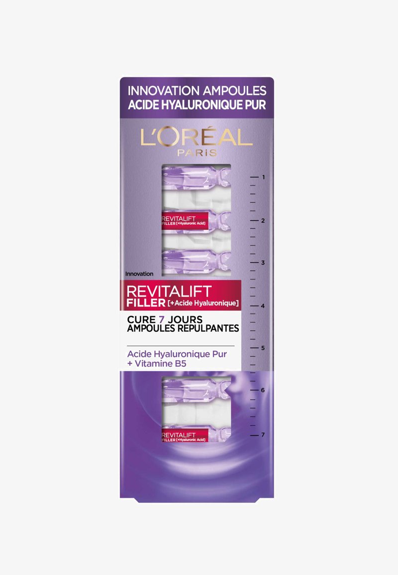 Ampoules L'Oréal Revitalift dans un emballage violet, avec des flacons en verre transparent, des accents blancs et une étiquette rouge bien visible avec les détails du produit.
