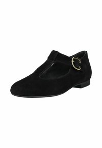 Chaussure plate en daim noir avec bride en T, bout arrondi, boucle dorée sur le côté, petit talon et découpe sur le dessus.