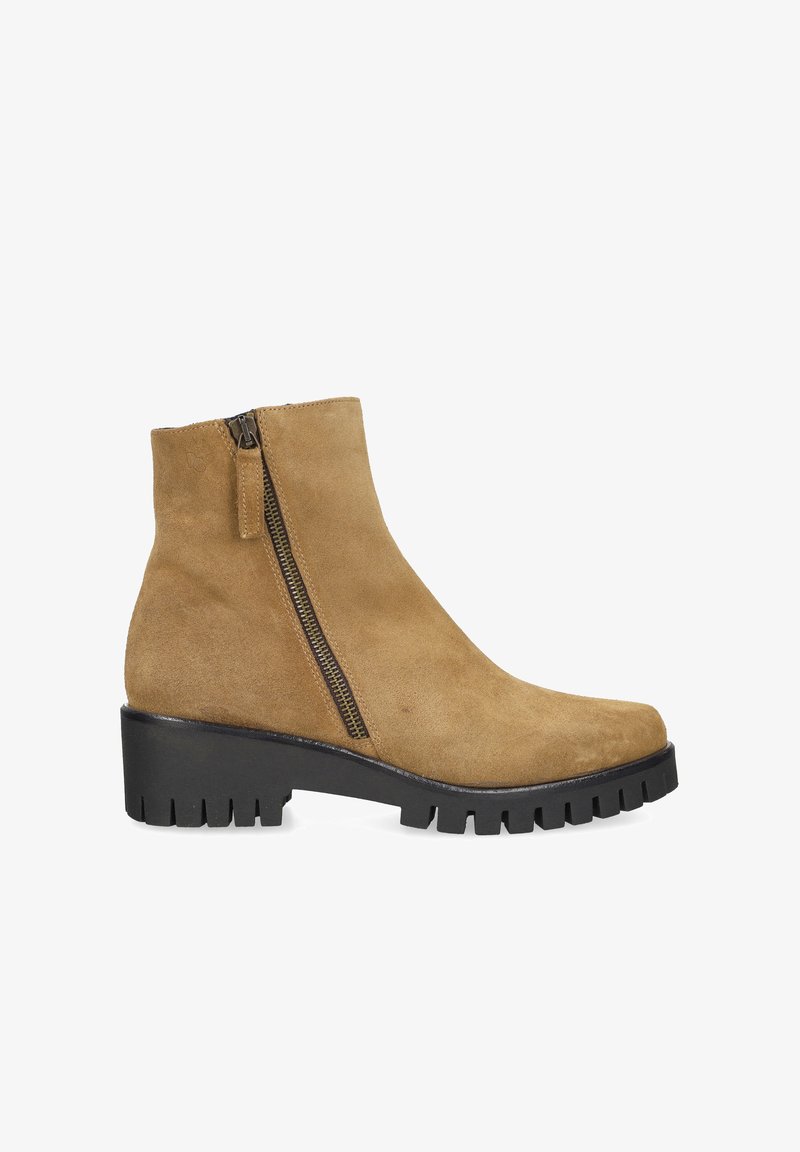 Tan suede ankle boot with black chunky treaded sole and side zipper on white background.