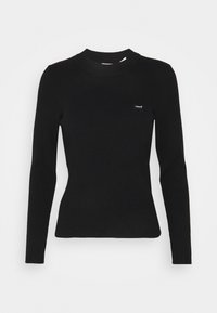 Suéter negro de manga larga de canalé con cuello alto y un pequeño logo blanco de Levi's en el lado izquierdo del pecho. Textura suave y diseño ajustado.