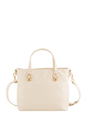 Cream tote bag with two handles, a detachable shoulder strap, gold-tone hardware, smooth texture, and circular accent details on the sides.