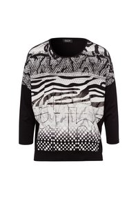 Schwarz-weißer Grafik-Top mit gemischten Mustern, einschließlich Streifen und Polka-Dots, mit einem Rundhalsausschnitt und dreiviertel Ärmeln.