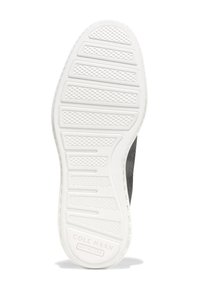 Suela de goma blanca con un patrón de agarre texturizado; presenta líneas horizontales elevadas y la impresión "COLE HAAN GRAND 360" para la marca.