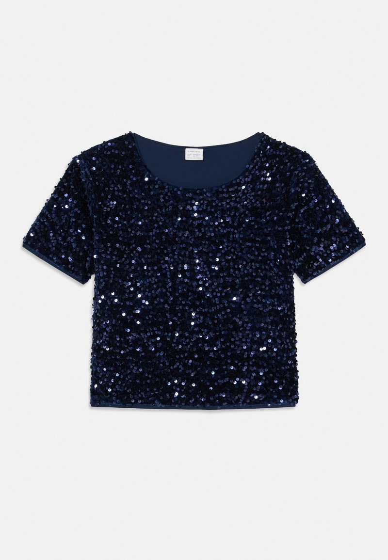 Mørkeblå kortærmet bluse dækket af palietter med rund halsudskæring. Glat stof underneden, skinnende tekstur med reflekterende elementer.