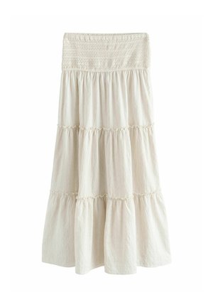 Kremowa, warstwowa długa spódnica maxi z marszczoną elastyczną talią i panelami zebranej tkaniny tworzącymi płynącą, pełną objętości sylwetkę.