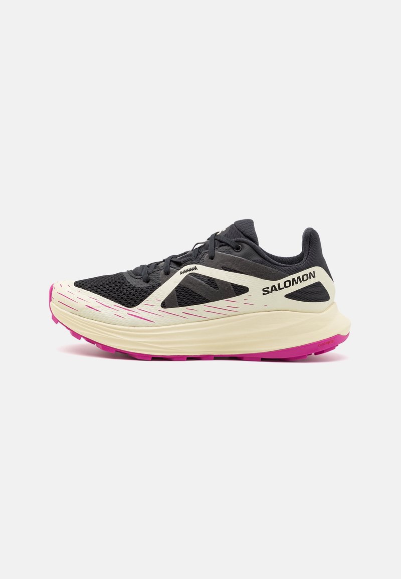 Black and beige Salomon running shoe with pink sole accents, mesh upper, and lace-up closure, shown in side profile on white background.