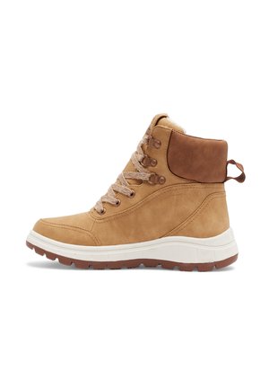 Bottine beige à lacets avec col rembourré, semelle blanche épaisse et languette au talon, conçue pour une utilisation en extérieur ou décontractée.