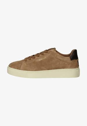Brown suede sneaker with a flat cream rubber sole, rounded toe, and tonal laces. Features brown leather accents at the heel and logo.