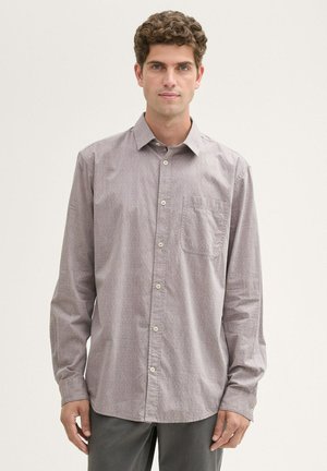 Button-up shirt in light purple with a subtle geometric pattern, long sleeves, single chest pocket, and classic collar detail.