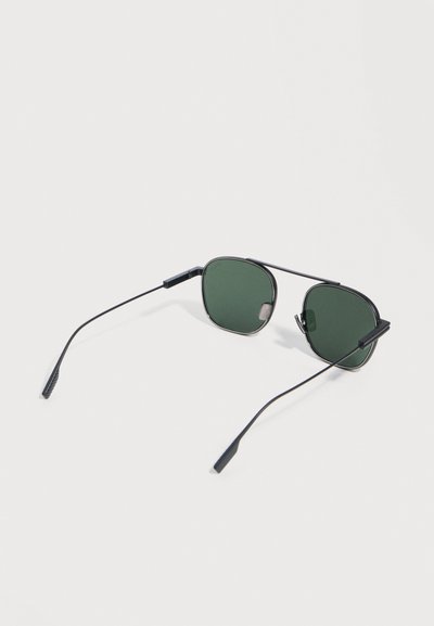 Black thin metal frame sunglasses with dark green square lenses, slim arms, and nose pads set on a white background.
