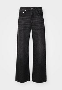 Weit geschnittene schwarze Jeans aus Denim mit glatter Textur, klassischem Fünf-Taschen-Design und silbernen Hardware-Details. Mit subtilen Verblassungen im Stoff.