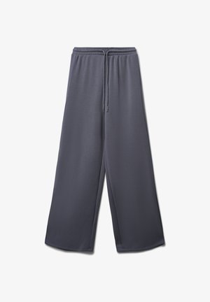 Pantaloni larghi grigi realizzati in tessuto morbido, dotati di un elastico in vita con cordino e una superficie liscia senza motivi.