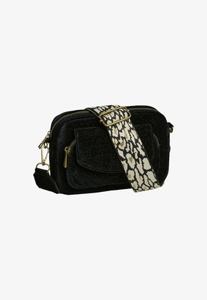 Sac en velours côtelé noir en bandoulière avec une poche zippée à l'avant et une large sangle réglable ornée d'un imprimé léopard noir et blanc.