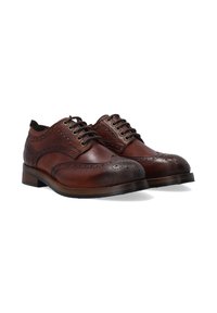 Braune Leder-Brogueschuhe mit perforierten Details, runden Zehen und braunen Schnürsenkeln. Besitzen einen gestapelten Absatz und eine glatte Oberfläche.
