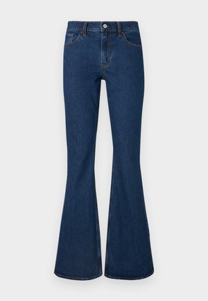 Jean en denim bleu foncé avec une taille haute et des jambes évasées larges, dotés de poches avant et arrière et d'un bouton de fermeture.
