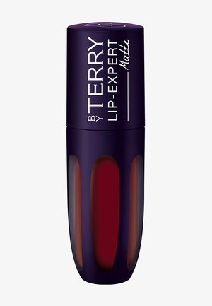 Liquid lipstick in a purple cylinder with a transparent section. Matte finish, showcasing a deep red shade inside. Glossy branded label.