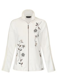 Veste en polaire blanche avec un col haut et une fermeture éclair à l'avant. Présente une broderie florale en gris et des tons terreux sur le côté gauche.