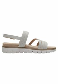 Sandali bianchi con suola piatta e imbottita. Presentano cinghie ampie con righe verticali e un design leggero e flessibile.