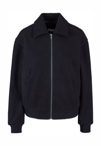 Veste noire zippée avec col large, manches longues, poignets et ourlet côtelés, conçue pour une coupe ajustée.