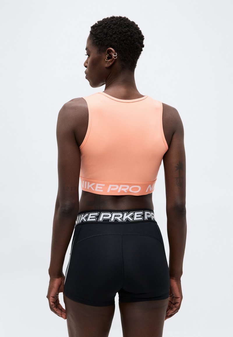 Nike Performance 365 CROP TANK - Top - crimson bliss/white