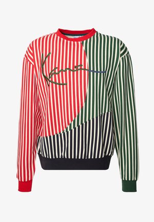 Sweat-shirt avec des rayures verticales rouges, vertes et bleu marine blanc, un col et des poignets rouges, un poignet droit vert, et une signature brodée sur la poitrine.