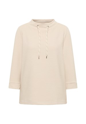 Top beige con collo alto, caratterizzato da un cordino e maniche a tre quarti. Tessuto testurizzato con sottili strisce orizzontali.