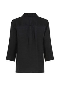 Chemise noire à manches longues avec un col droit, vue de dos, présentant une empiècement et un pli central en détail.