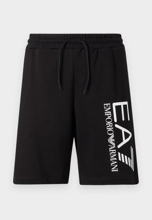 Pantalones cortos de algodón negro con cintura elástica y cordón ajustable. Presentan un gran logo blanco en la pierna izquierda.