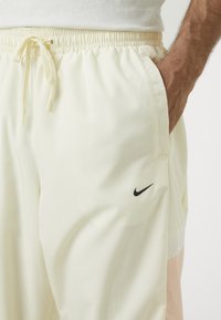 Nike Performance ICON PANT  - Træningsbukser - coconut milk/washed coral/black