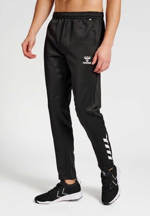 CORE - Tracksuit bottoms - black