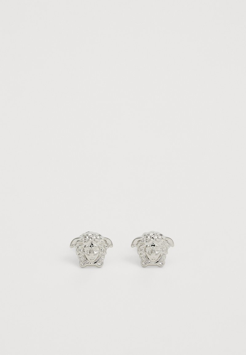 Hõbedased lõvi pea mansetid, millel on detailsed graveeringud, rõhutades silmapaistvaid näojooni ja tekstuure. Ümmargune kuju, poleeritud viimistlus.