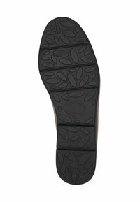 Černá guma podešve s ergonomickým designem a texturou ve tvaru kruhů a oválů, což naznačuje přilnavost a flexibilitu. Velikost 37.