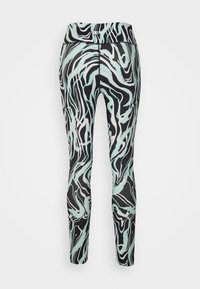 Leggings de cintura alta con un patrón ondulado en negro, blanco y menta; tejido suave y elástico; diseñados para ofrecer comodidad y flexibilidad.