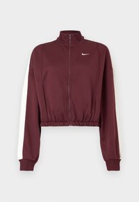 Bordo skrátená bunda s vysokým golierom, plným zipsom a bielymi bočnými pruhmi. Vyrobená z hladkej látky, s elastickým lemom a manžetami.