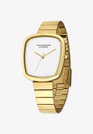 Goldene Metallarmbanduhr mit quadratischem Gehäuse, weißem Zifferblatt, schwarzem Markennamen und goldenen Stunden- und Minutenzeigern; verlinktes Armband mit glänzender Oberfläche.