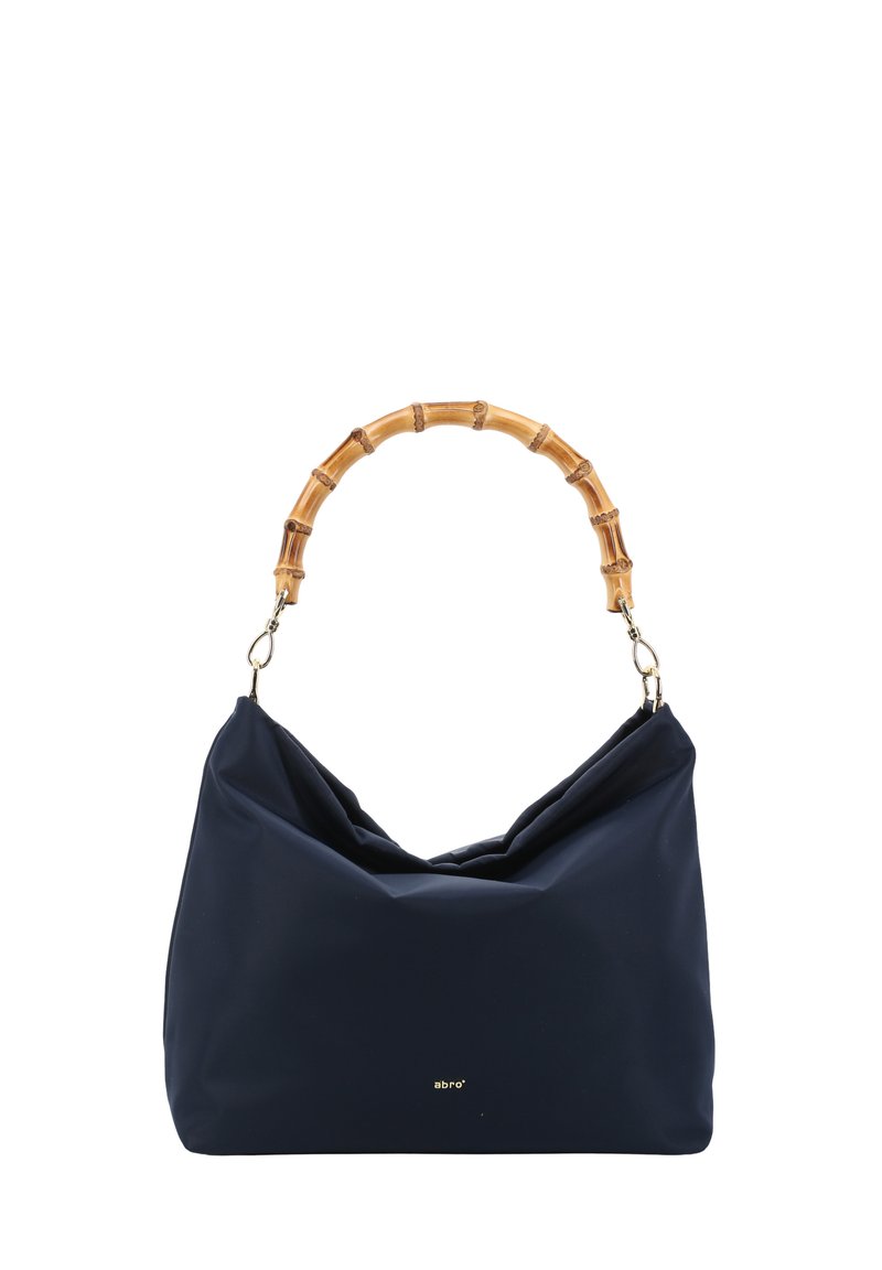 Navy blue fabric handbag with a knotted design, featuring a bamboo handle and metal hardware, displaying a small logo in gold.