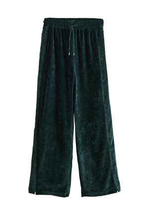 Dunkelgrüne Samt-Hosen mit weitem Bein, elastischem Bund und Kordelzug. Sie zeichnen sich durch eine glatte Textur und seitliche Schlitze an den Säumen aus.