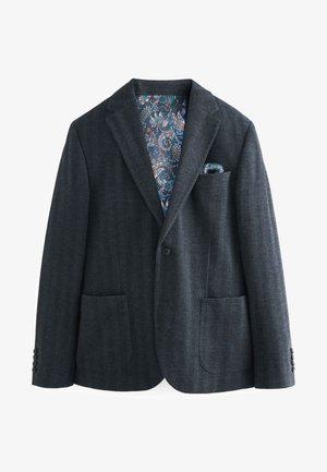Blazer de espiga gris oscuro con solapas con muesca, dos bolsillos frontales y forro de estampado paisley colorido. Cierre frontal con botón.