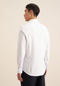Seidensticker SLIM - Camicia elegante - light blue