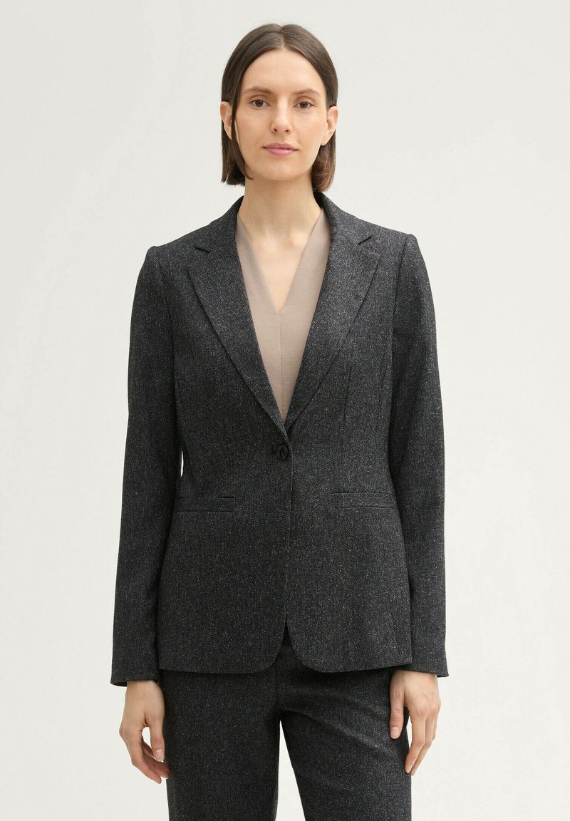Dark gray blazer made of textured fabric with a fitted design, single button closure, notch lapels, and two front pockets.