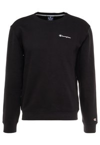 Sudadera negra de mezcla de algodón, con mangas largas, puños acanalados y cuello redondo. Pequeño logo bordado en el pecho.
