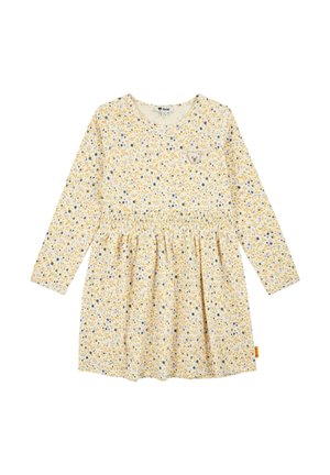 Langärmliges kremfarbenes Kleid mit gelbem und blauem Blumenmuster und kleinem Bären-Gesicht-Aufnäher auf der Brust, elastischer Taille und rundem Ausschnitt.