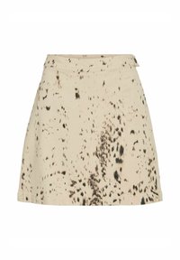 Jupe en coton beige à coupe évasée, ornée d'un motif abstrait noir et d'une ceinture. Design minimaliste sans fermetures visibles.