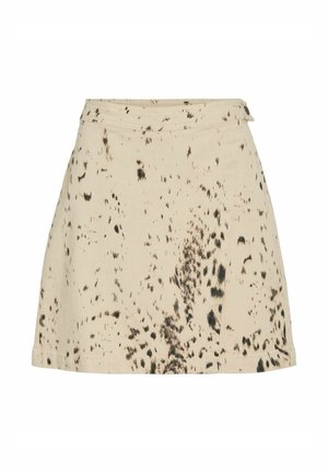 Jupe en coton beige à coupe évasée, ornée d'un motif abstrait noir et d'une ceinture. Design minimaliste sans fermetures visibles.